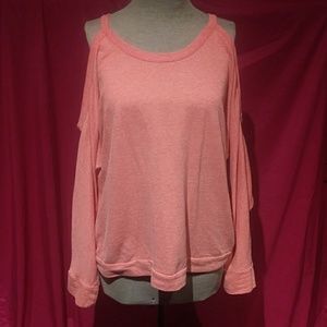 Coral-colored cold shoulder shirt